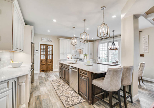 New kitchen island with cloth-covered stools, one of our Leesburg kitchen remodel projects.